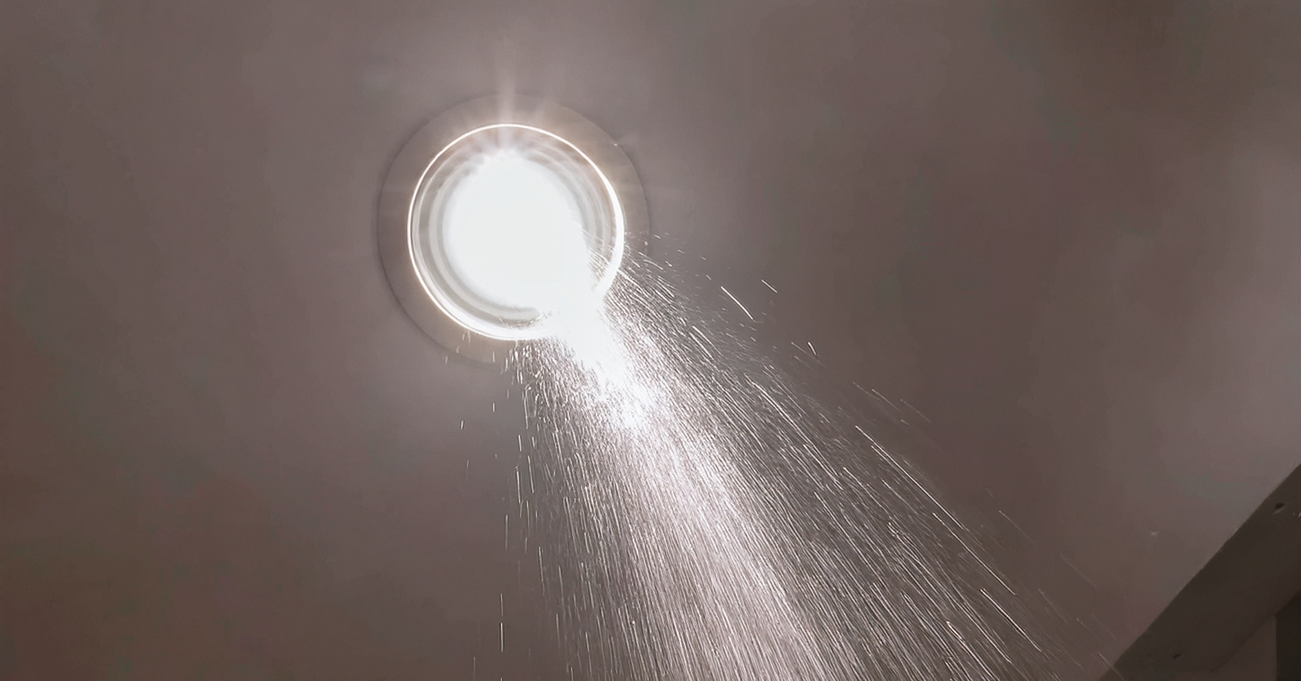 Water pouring through light fitting
